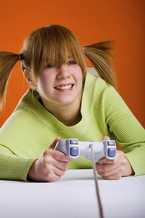 Framed Print : Girl with a Game Controller Playing a Computer Game Print Framed Print : Girl with a Game Controller Playing a Computer Game Print