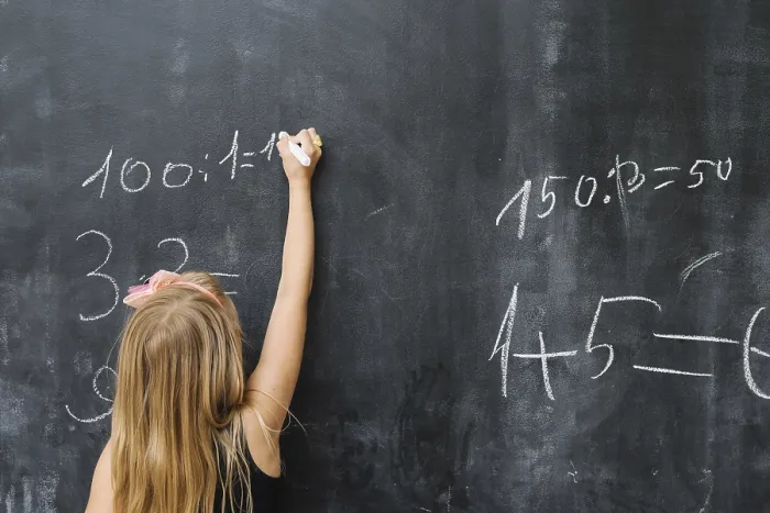 Framed Print : Girl solving math exercise Print Framed Print : Girl solving math exercise Print