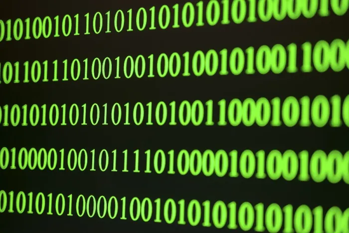 Framed Print : Green binary code print on dark background