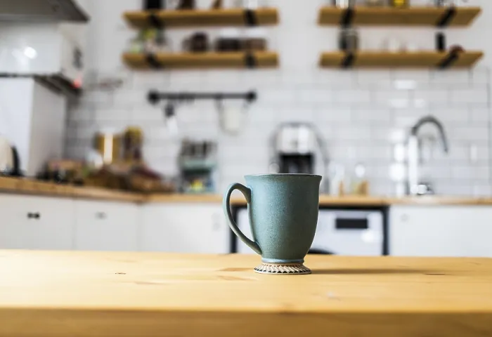 Framed Print : Green Coffee Cup Print on Kitchen Table Framed Print : Green Coffee Cup Print on Kitchen Table