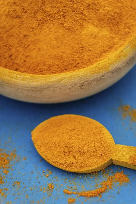 Framed Print : Ground Turmeric Print on Blue Background Framed Print : Ground Turmeric Print on Blue Background