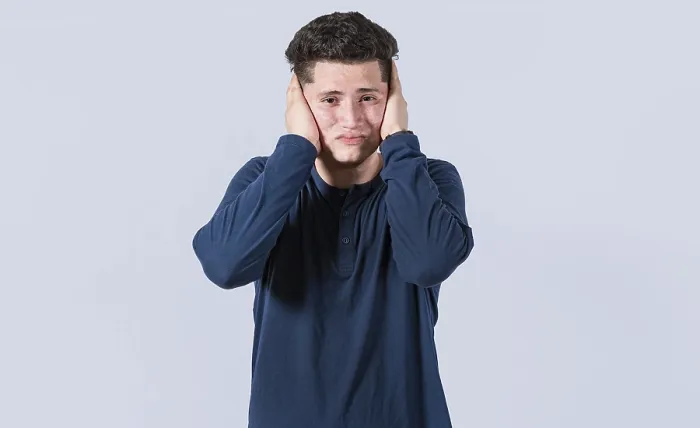 Framed Print : Man Covering Ears Print - Deafening Concept