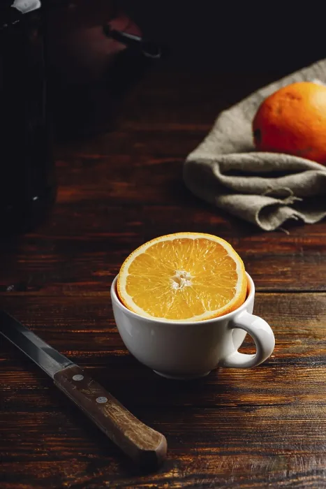 Framed Print : Half of Orange in a White Cup Print Framed Print : Half of Orange in a White Cup Print