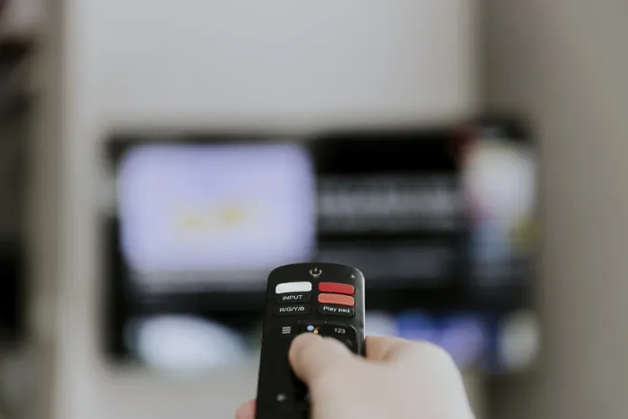 Framed Print : Print of Person Browsing TV Options at Home Framed Print : Print of Person Browsing TV Options at Home