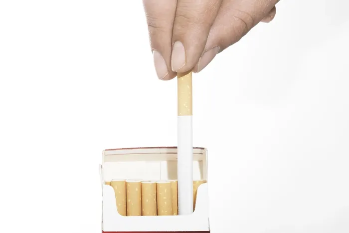 Framed Print : Hand taking cigarette from pack Print Framed Print : Hand taking cigarette from pack Print
