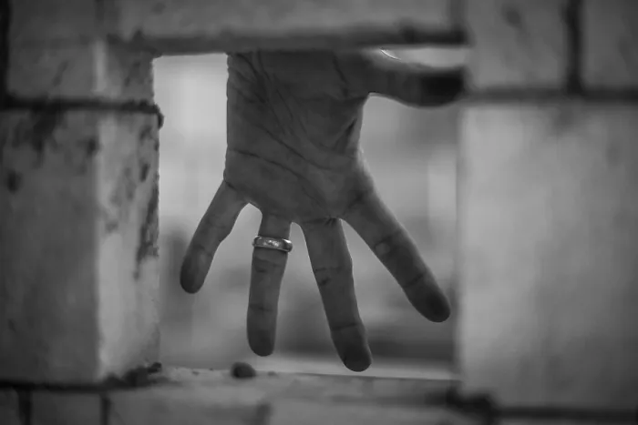 Framed Print : Black and White Print of Hand through Brick Wall Framed Print : Black and White Print of Hand through Brick Wall
