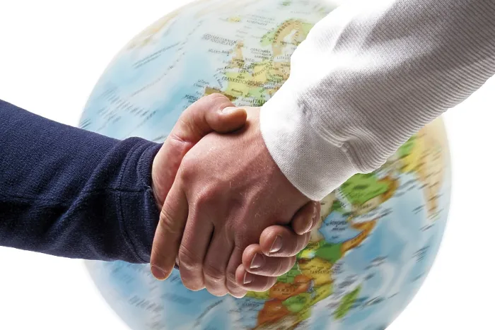 Framed Print : Handshake in front of a globe Print Framed Print : Handshake in front of a globe Print
