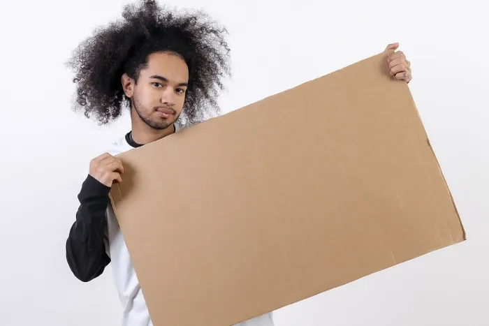 Framed Print : Young Man Holding Sign Print on White Background Framed Print : Young Man Holding Sign Print on White Background