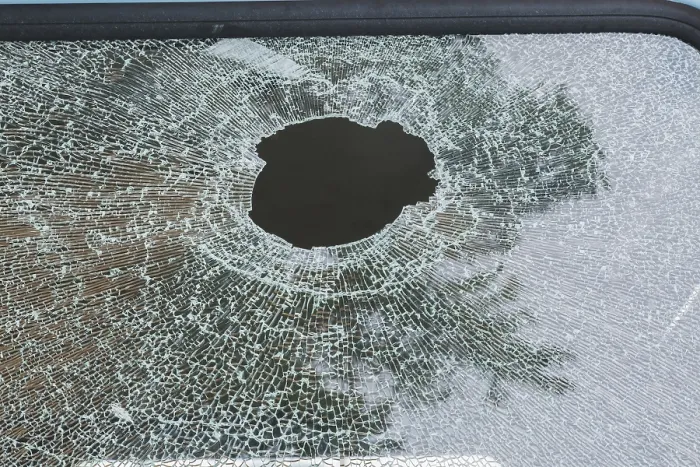 Framed Print : Hole in Shattered Side Window of Mini-Van Print Framed Print : Hole in Shattered Side Window of Mini-Van Print