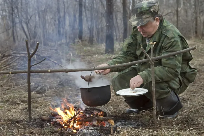 Framed Print : The Hunter Makes a Dinner on a Bonfire Print Framed Print : The Hunter Makes a Dinner on a Bonfire Print