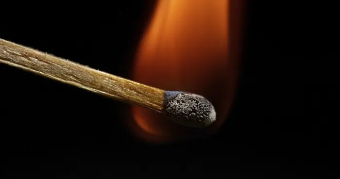 Framed Print : Igniting Match Print against Black Background