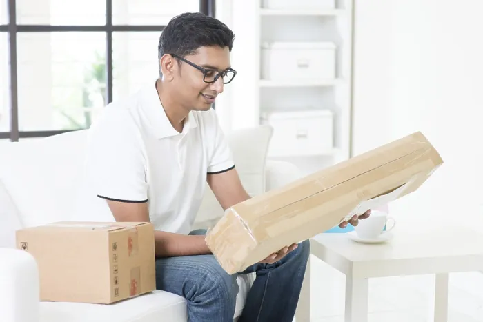 Framed Print : Indian Man Checking Express Parcel Print