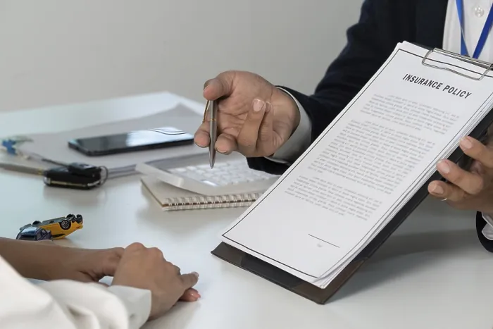 Framed Print : An Insurance Agent Presenting a Policy Document Print