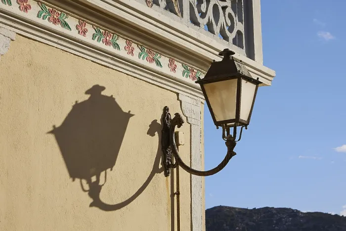 Framed Print : Lantern Casts a Shadow on a Yellow House Facade Print Framed Print : Lantern Casts a Shadow on a Yellow House Facade Print