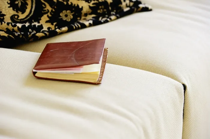 Framed Print : A Leather-Bound Notebook on a Sofa Print Framed Print : A Leather-Bound Notebook on a Sofa Print