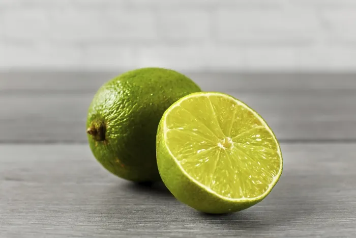 Framed Print : Whole Lime and Half Cut Print on Wooden Table Framed Print : Whole Lime and Half Cut Print on Wooden Table