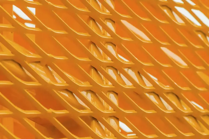 Framed Print : Macro Print of Yellow Metal Structure with V-Shaped Patterns Framed Print : Macro Print of Yellow Metal Structure with V-Shaped Patterns