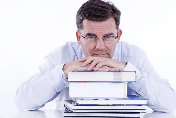 Framed Print : Man in His 50s Leaning on Books Print Framed Print : Man in His 50s Leaning on Books Print