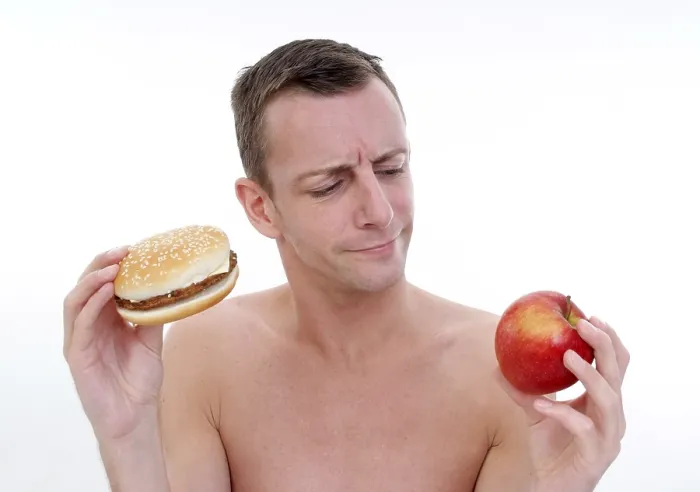 Framed Print : Man with Burger and Apple Print Framed Print : Man with Burger and Apple Print