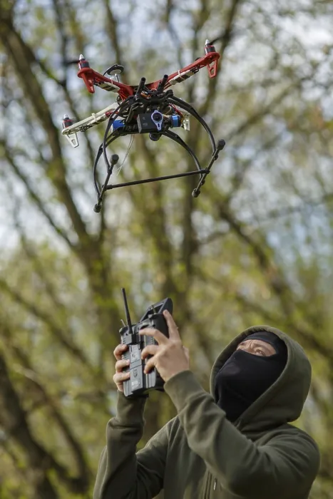 Framed Print : Man in Mask Operating Drone Print Framed Print : Man in Mask Operating Drone Print