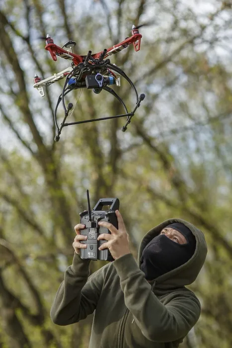 Framed Print : Man in Mask Operating Drone Print