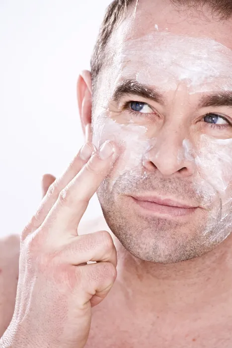 Framed Print : Man Applying Lotion Print Framed Print : Man Applying Lotion Print