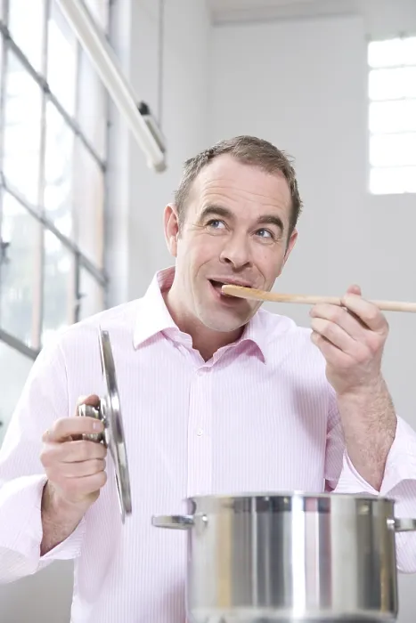 Framed Print : Man Tasting from Saucepan Print Framed Print : Man Tasting from Saucepan Print