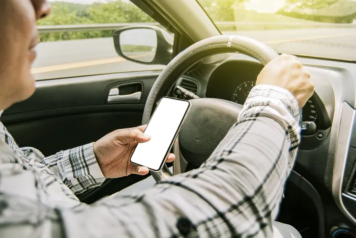 Framed Print : Man using phone while driving print Framed Print : Man using phone while driving print