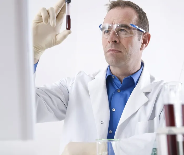 Framed Print : Man Working on an Experiment in a Laboratory Print