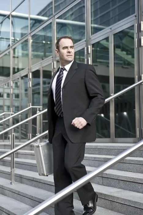 Framed Print : Manager Leaving Office Building Print