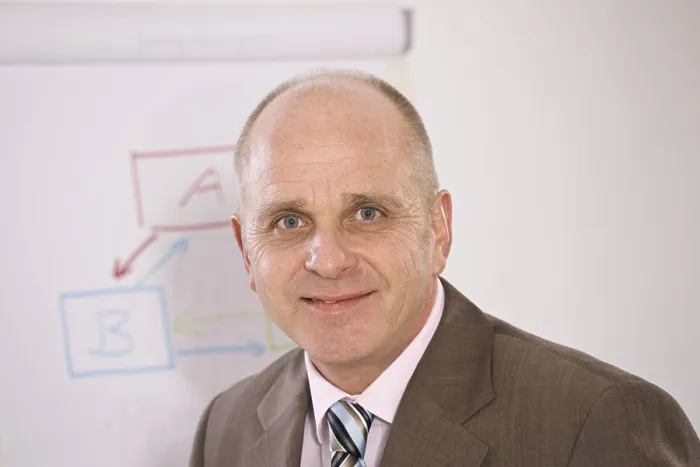 Framed Print : Manager Standing in Front of a Flip Chart Print