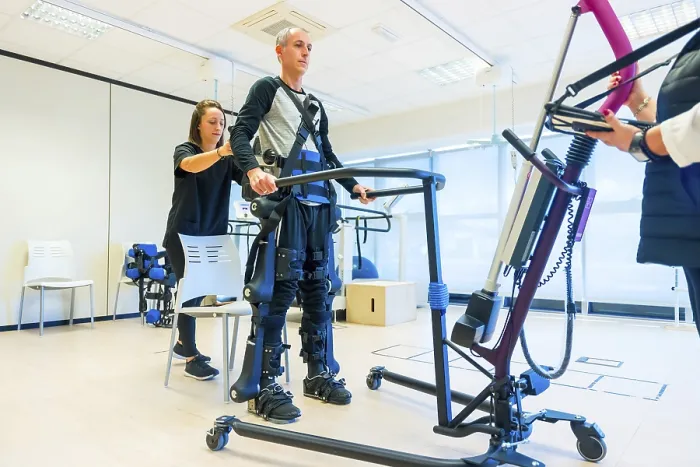Framed Print : Female Physiotherapist and Mechanical Exoskeleton Print Framed Print : Female Physiotherapist and Mechanical Exoskeleton Print
