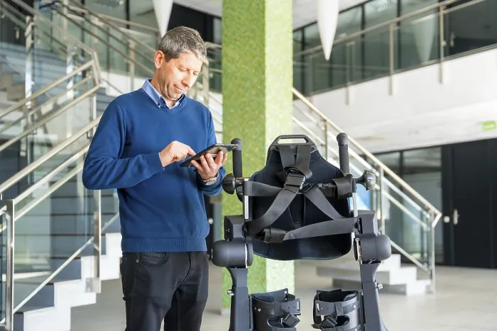 Framed Print : Mechanical Exoskeleton Engineer with Tablet Print Framed Print : Mechanical Exoskeleton Engineer with Tablet Print