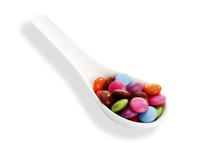 Framed Print : Multicoloured Smarties Print on a Spoon Framed Print : Multicoloured Smarties Print on a Spoon
