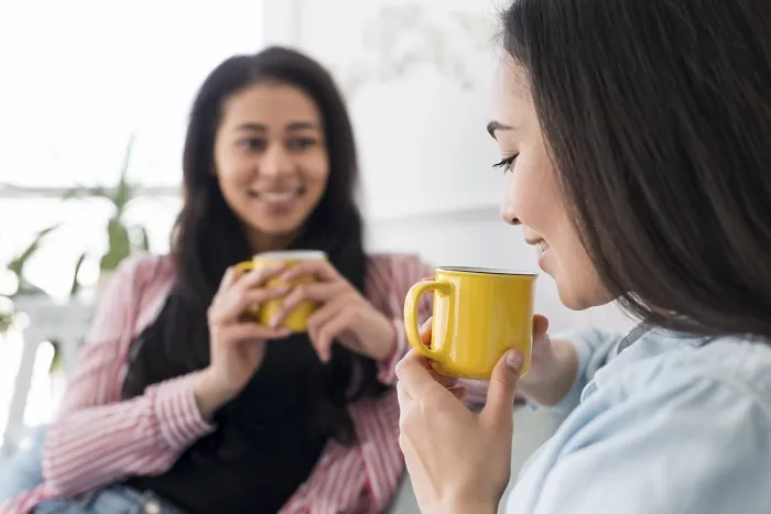 Framed Print : Multiethnic girlfriends talking drinking tea Print Framed Print : Multiethnic girlfriends talking drinking tea Print