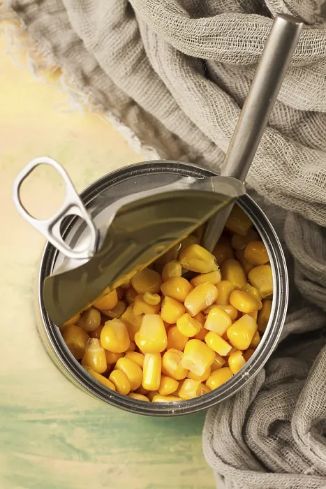 Framed Print : Open Tin Can with Corn Print, Top View Framed Print : Open Tin Can with Corn Print, Top View
