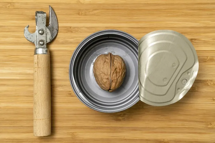 Framed Print : Can Opener Print with Walnut in Tin Can Framed Print : Can Opener Print with Walnut in Tin Can