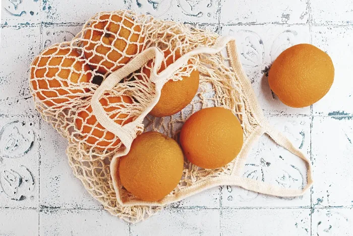 Framed Print : Oranges in a mesh bag Print, textured surface Framed Print : Oranges in a mesh bag Print, textured surface