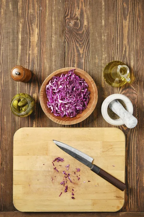 Framed Print : Overhead view of kitchen tabletop with red cabbage and pickled cucumbers print Framed Print : Overhead view of kitchen tabletop with red cabbage and pickled cucumbers print