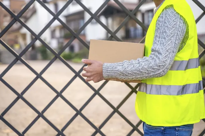 Framed Print : Package Delivery Worker Waiting Outside the House Print Framed Print : Package Delivery Worker Waiting Outside the House Print