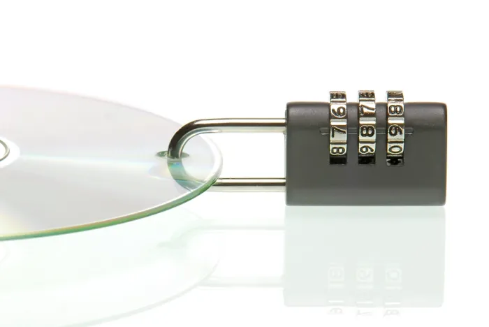 Framed Print : Padlock on CD Print: Symbol of Data Security Framed Print : Padlock on CD Print: Symbol of Data Security