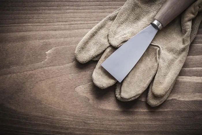 Framed Print : Paint scraper on working glove Print