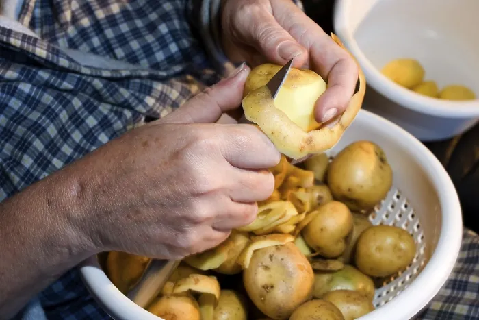 Framed Print : Peeling Potatoes Print by ImageBROKER Framed Print : Peeling Potatoes Print by ImageBROKER