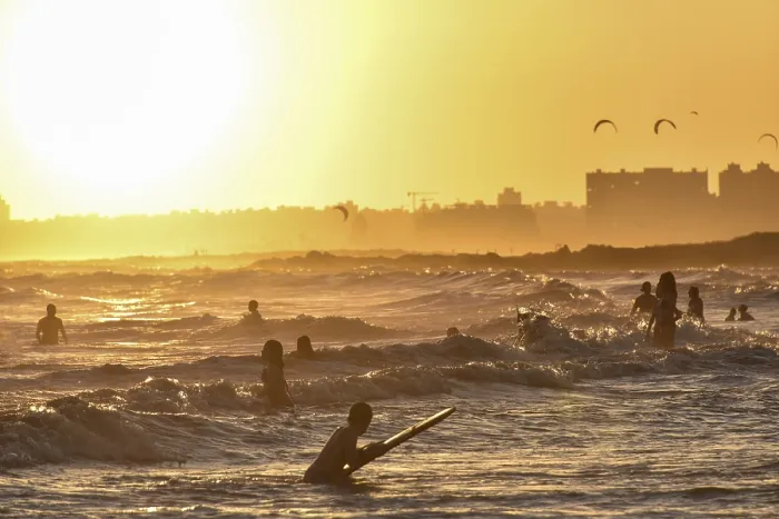 Framed Print : People Bathing on Beach at Sunset Print, Montevideo, Uruguay Framed Print : People Bathing on Beach at Sunset Print, Montevideo, Uruguay