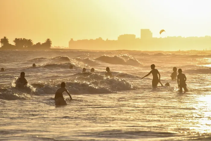 Framed Print : Many People Bathing on Beach at Sunset Print, Uruguay Framed Print : Many People Bathing on Beach at Sunset Print, Uruguay