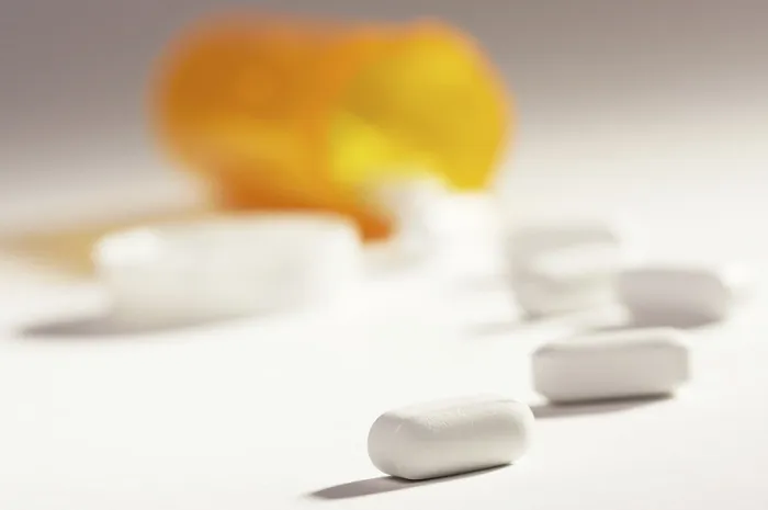 Framed Print : Dramatic Lighting Print of Pills and Fallen Bottle Framed Print : Dramatic Lighting Print of Pills and Fallen Bottle