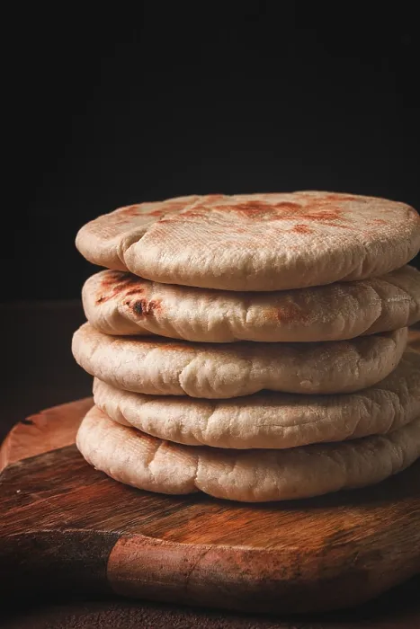 Framed Print : Pita Bread Stack Print on Wooden Table Framed Print : Pita Bread Stack Print on Wooden Table