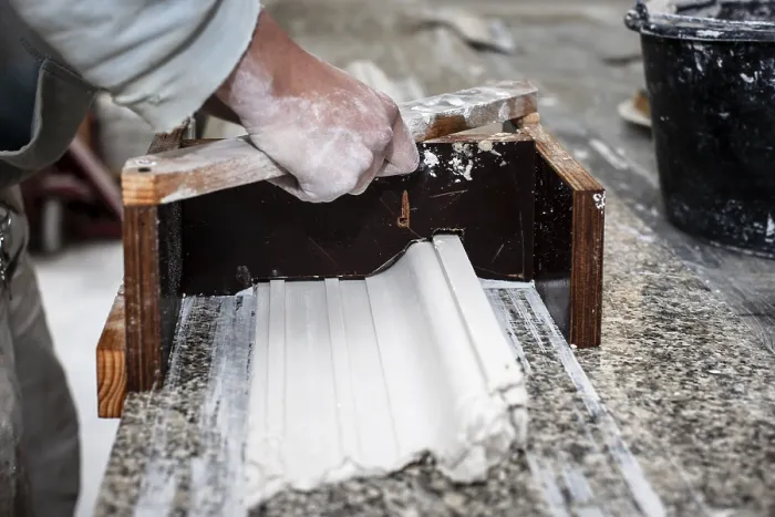 Framed Print : A Plasterer Creates a Stucco Profile Print Framed Print : A Plasterer Creates a Stucco Profile Print