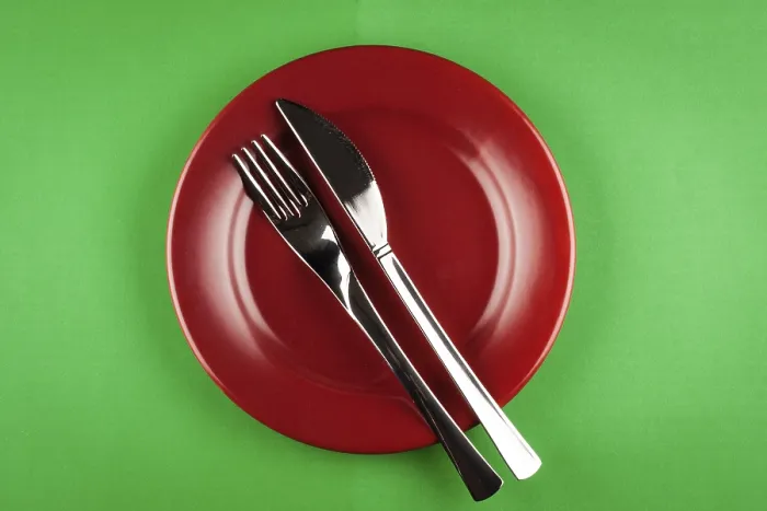 Framed Print : Plate with knife and fork on green table Print Framed Print : Plate with knife and fork on green table Print