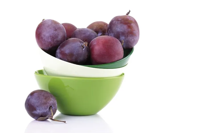 Framed Print : Plums in a colourful stack of bowls Print
